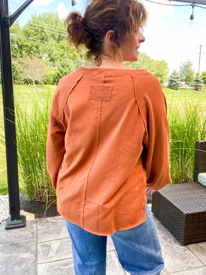 Dakota Exposed Seam Relaxed Fit Long Sleeve Top in Rust